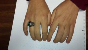 Student reading braille